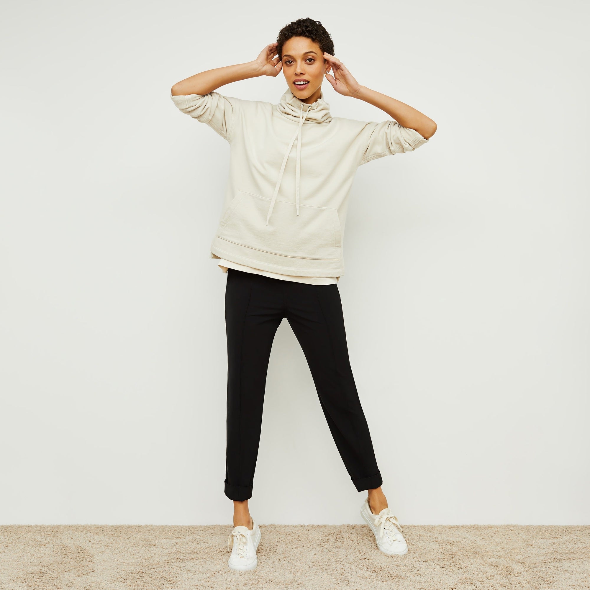 Front image of a woman standing wearing the Colby Jogger in Black | Exclude