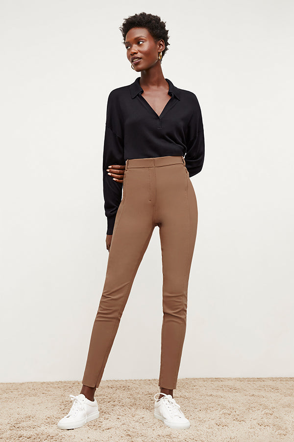Front image of a woman standing wearing the Curie Pant—Everstretch in Saddle | Exclude