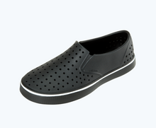 Angled view of a Native Shoes Miles | Jiffy Black/ Jiffy Black Footwear
