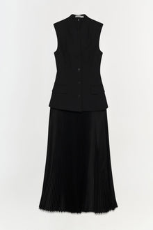Black sleeveless button-front vest dress with pleated skirt and chest pockets.