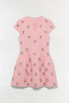 Pink mini dress with silver beaded floral embellishments, short sleeves, and tiered skirt design.