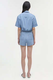 Light blue denim bishop cotton top with short sleeves and belted waist, shown from back view.