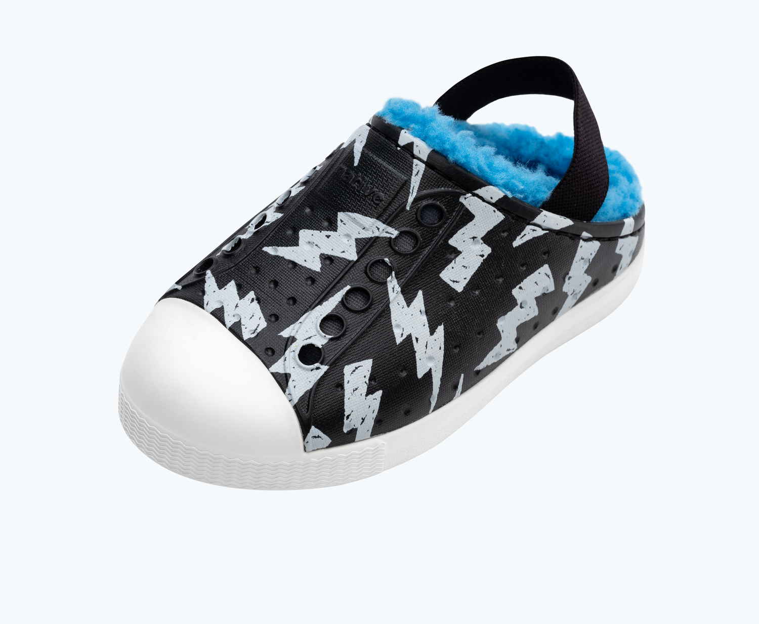Angled view of a Native Shoes Kids Jefferson Cozy Glow Kids | Jiffy Black/ Shell White/ Shell Lightning Glow Footwear