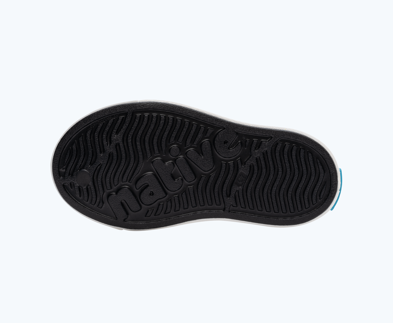 Bottom view of a Native Shoes Kids Jefferson Cozy Glow Kids | Jiffy Black/ Shell White/ Shell Lightning Glow Footwear