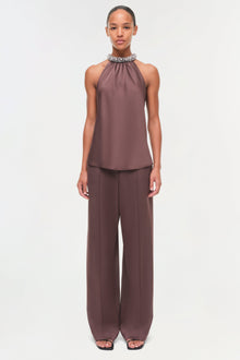 Mauve satin sleeveless halter top with beaded neckline embellishment, paired with matching wide-leg trousers.