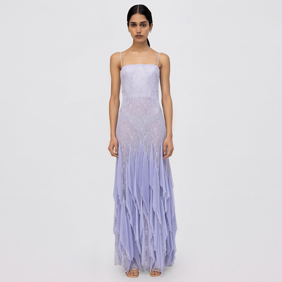 Lavender lace sleeveless gown with pleated skirt and asymmetrical handkerchief hem.