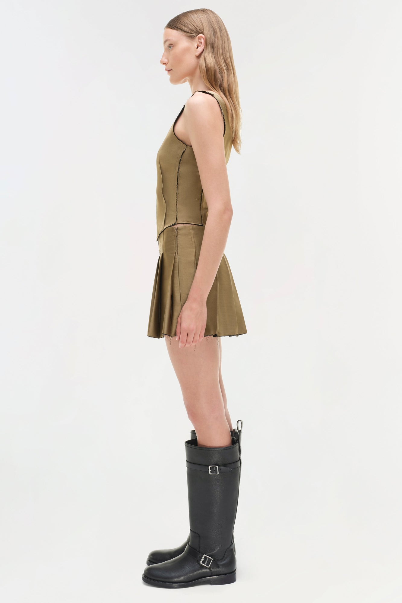 Olive sleeveless bustier top with fitted bodice and pleated skirt detail, shown from the side.