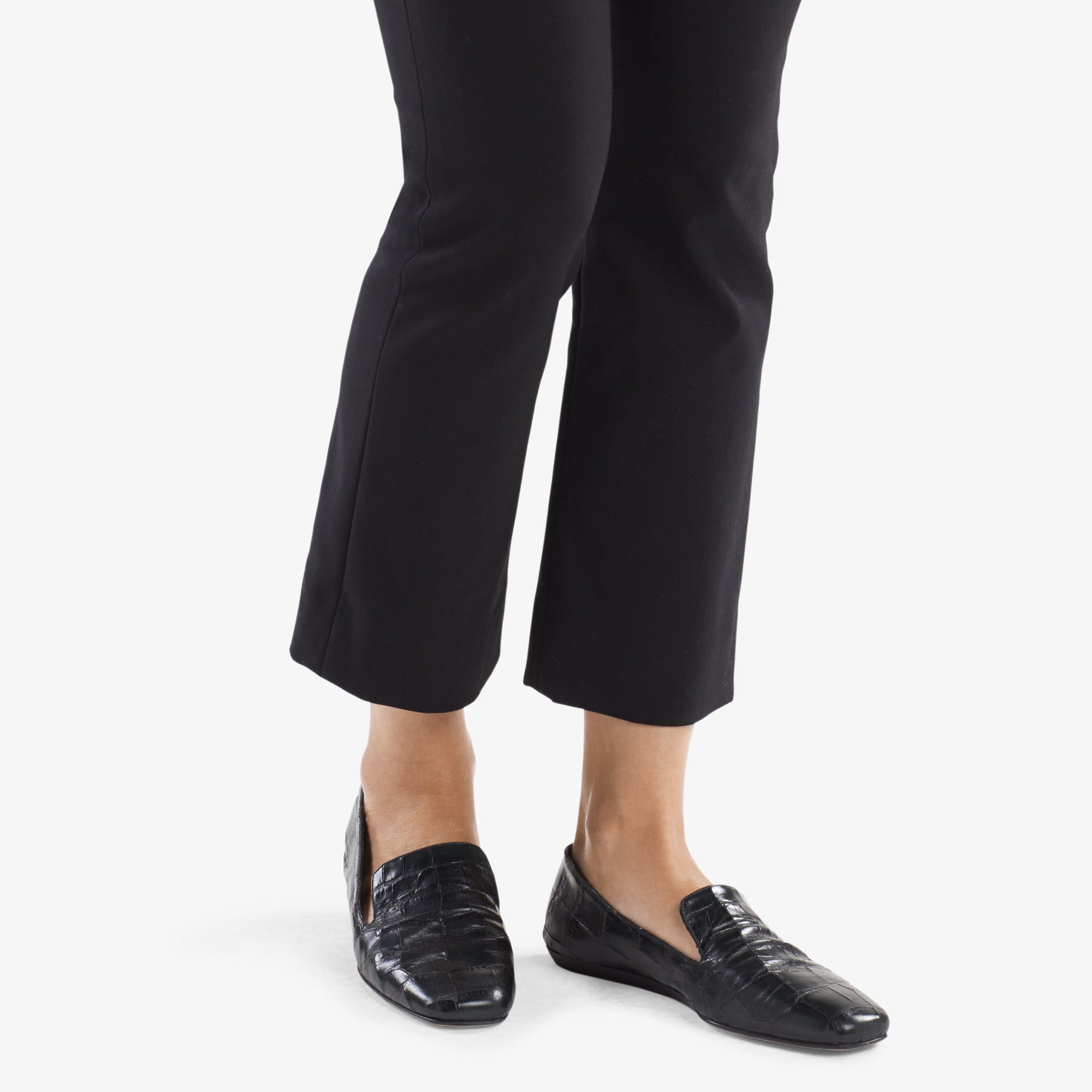 image of a woman wearing the grace loafer in green croc 