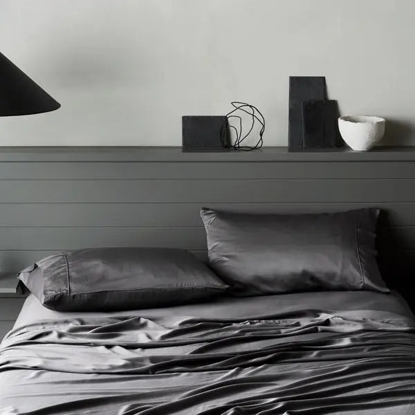 Luxe bamboo pillowcases in slate add contrast and calm to neutral palettes with breathable sophistication