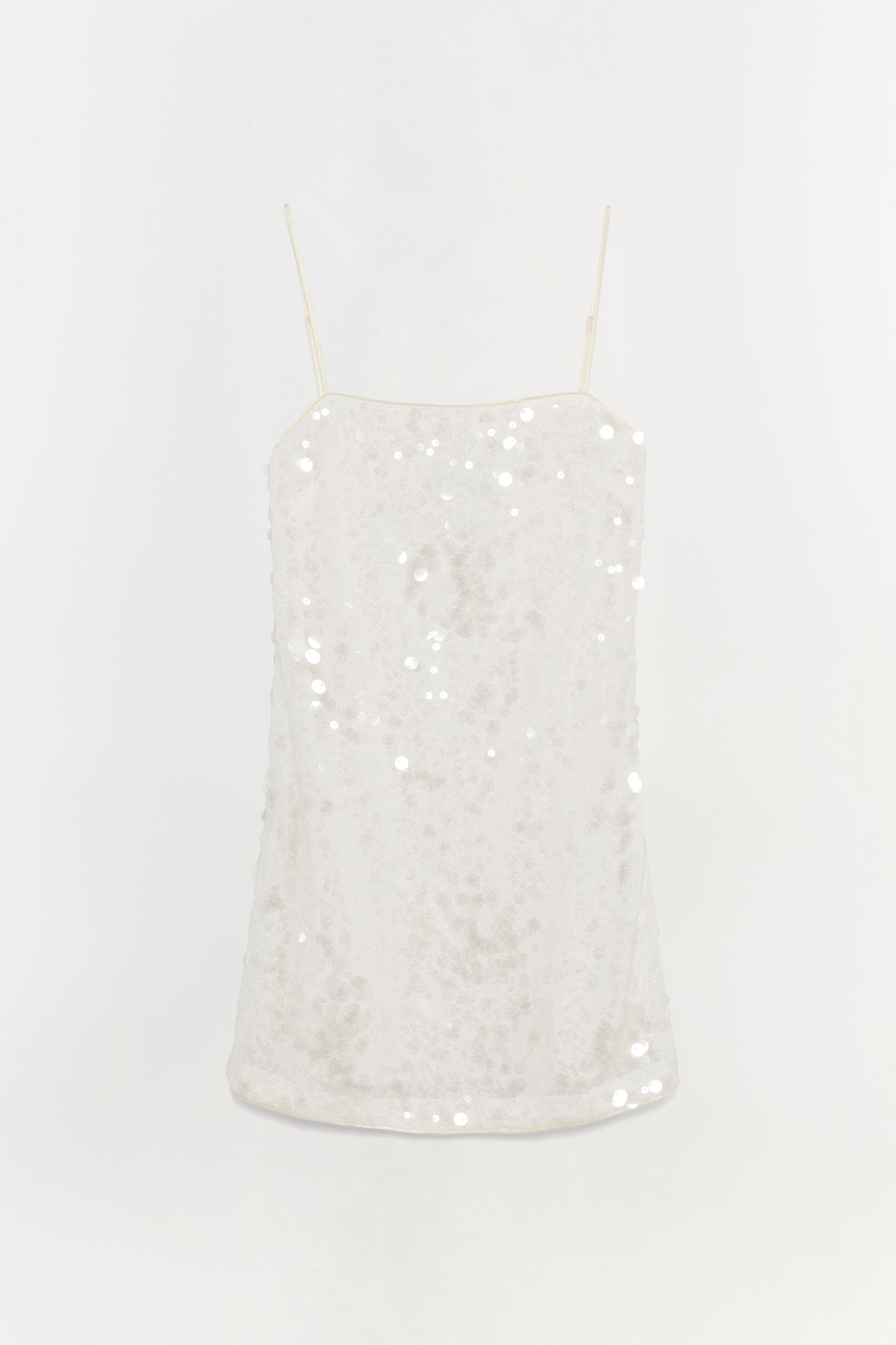 Ivory mini dress with sequin embellishments and thin spaghetti straps.