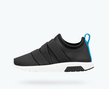 Side view of a Native Shoes Kids Phoenix Kids | Jiffy Black/ Shell White Footwear