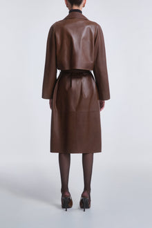 Model is wearing Nour Hammour Cisely Relaxed Leather Coat Canelle - Back