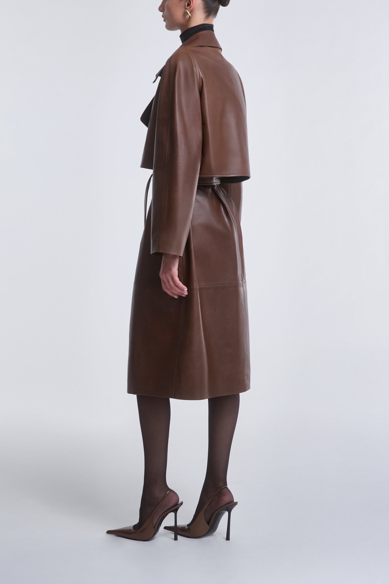 Model is wearing Nour Hammour Cisely Relaxed Leather Coat Canelle - Side