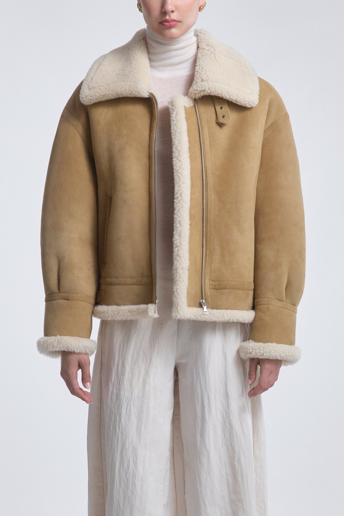 Model is Wearing the Nour Hammour Portia Modern Shearling Aviator Jacket Biscuit - Front Open