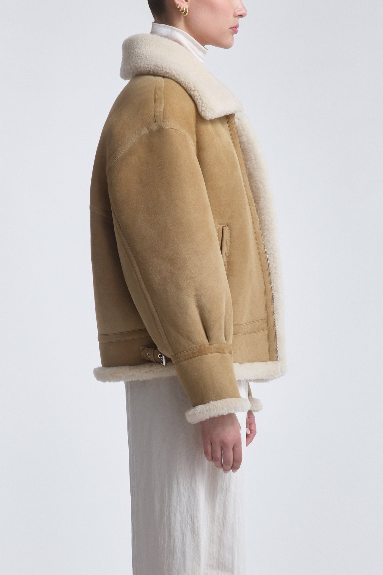 Model is Wearing the Nour Hammour Portia Modern Shearling Aviator Jacket Biscuit - Side