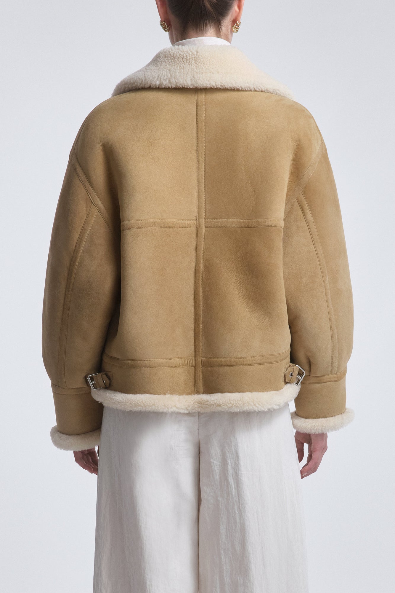 Model is Wearing the Nour Hammour Portia Modern Shearling Aviator Jacket Biscuit - Back