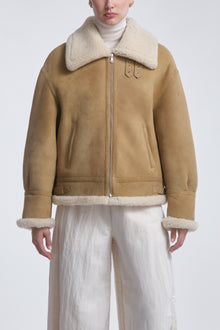 Model is Wearing the Nour Hammour Portia Modern Shearling Aviator Jacket Biscuit - Front