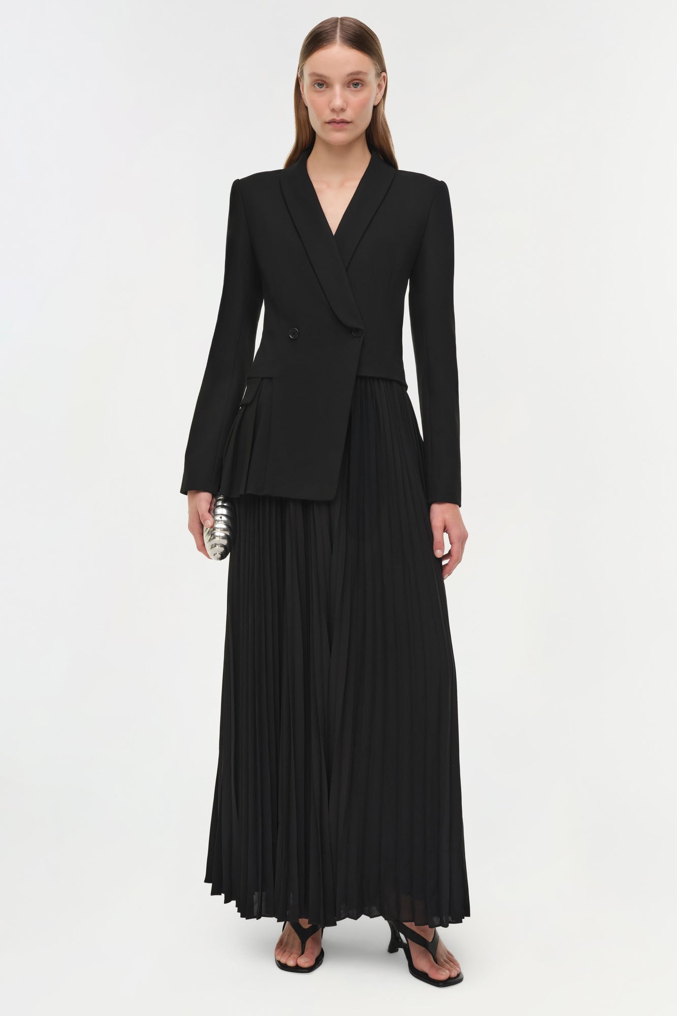 Black double-breasted blazer dress with long sleeves and pleated maxi skirt.