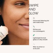 Cosmetic stick being applied to skin with product features listed on the right