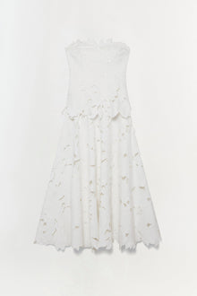 White sleeveless midi dress with leaf-shaped embroidered cutouts throughout bodice and skirt.
