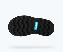 Bottom view of a Native Shoes Kids Kensington Treklite Gloss Kids | Shell White Gloss/ Jiffy Black Footwear