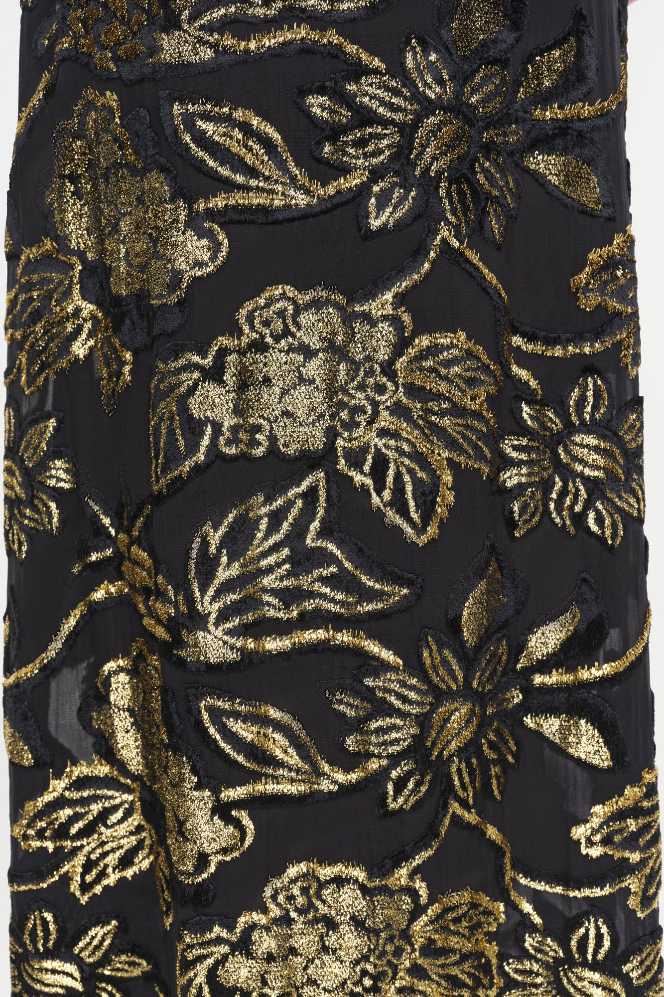 Black gown with gold embroidered floral and leaf motifs throughout.