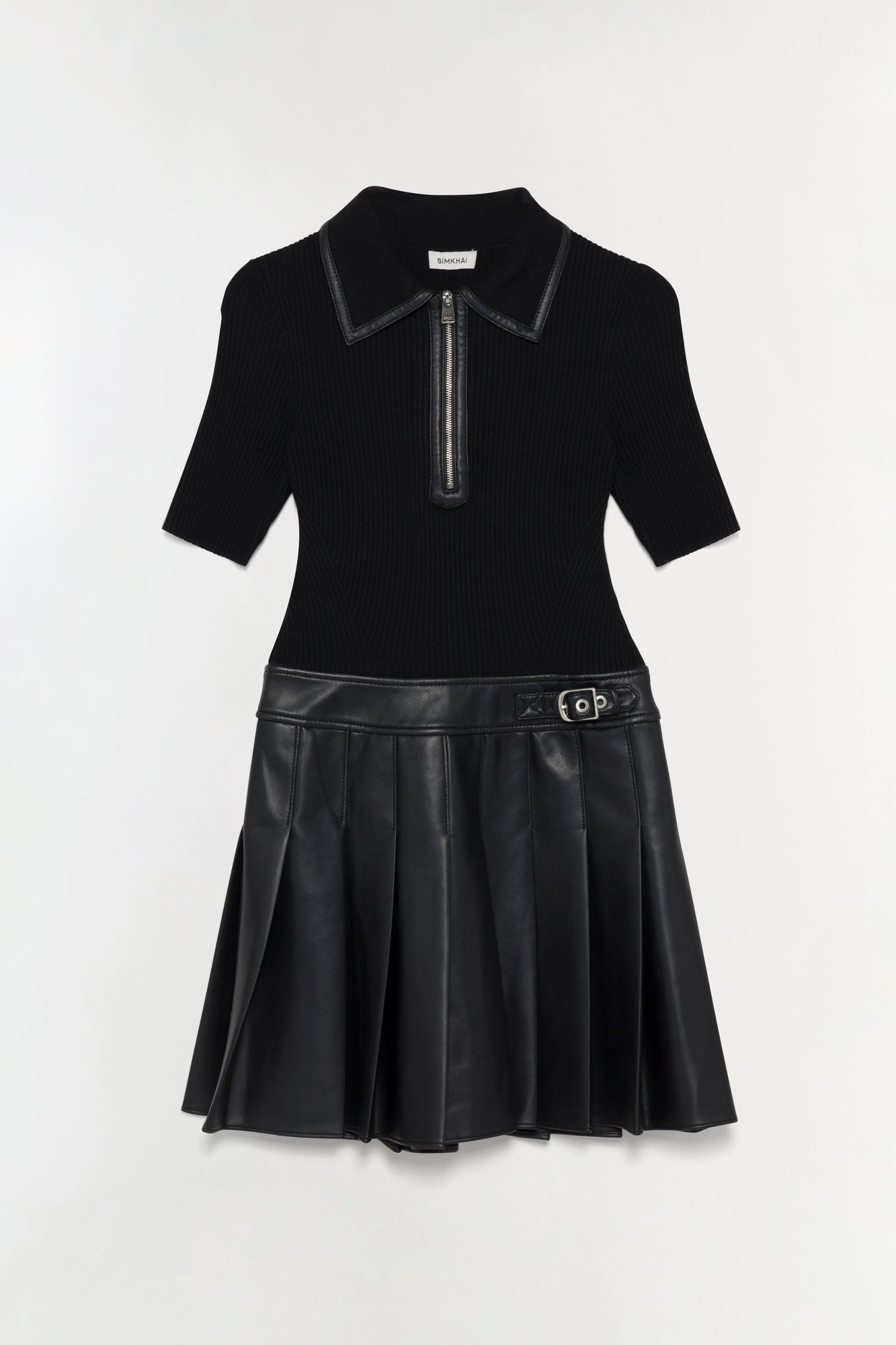 Black mini dress with ribbed knit polo top, leather trim collar, zip placket, and pleated faux leather skirt with belt detail