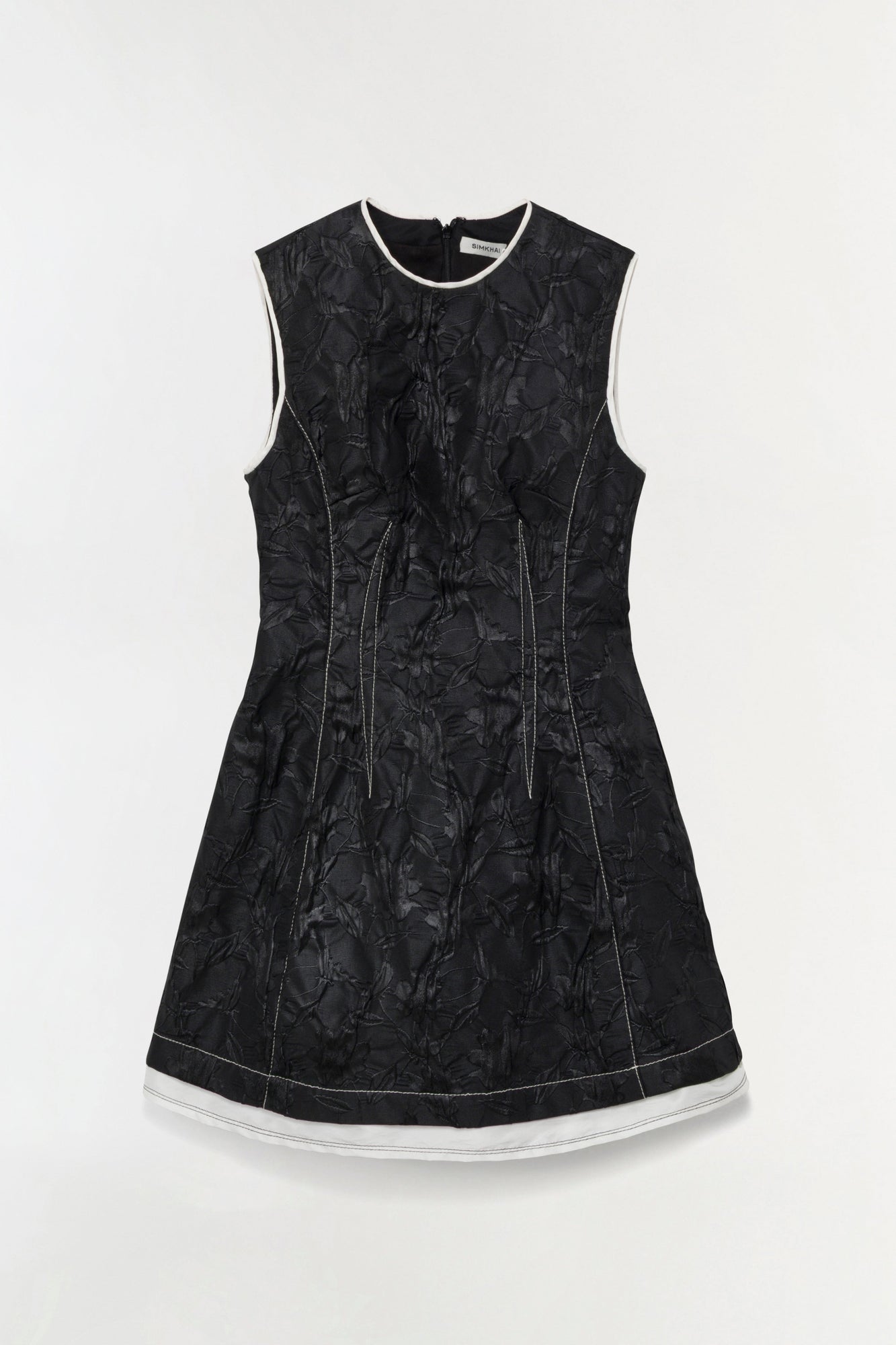Black jacquard sleeveless mini dress with white trim at neckline and hem, featuring center seam details.