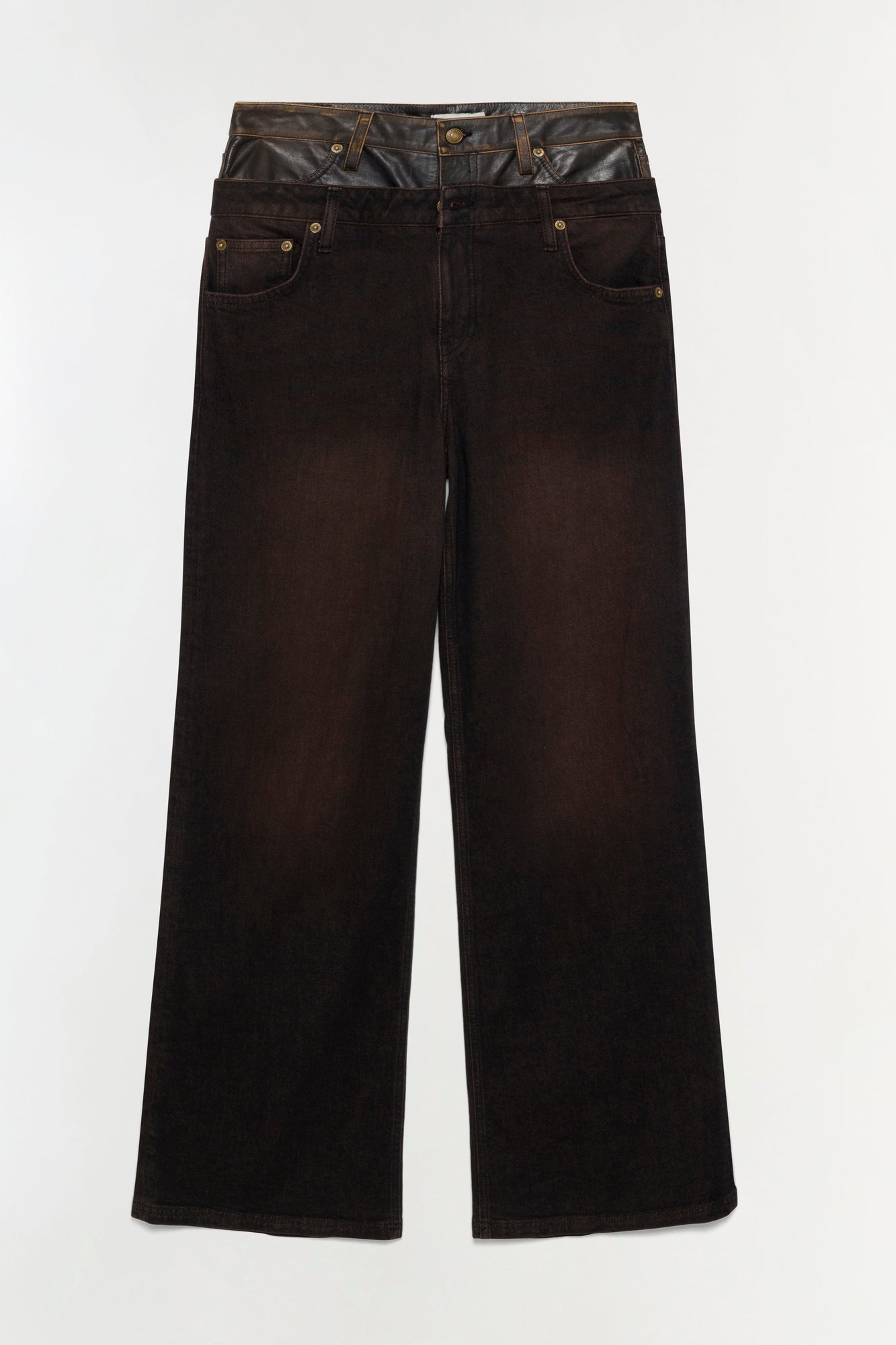 Dark indigo denim jeans with dual waistband detail in contrasting leather and denim, five-pocket construction, and wide-leg s