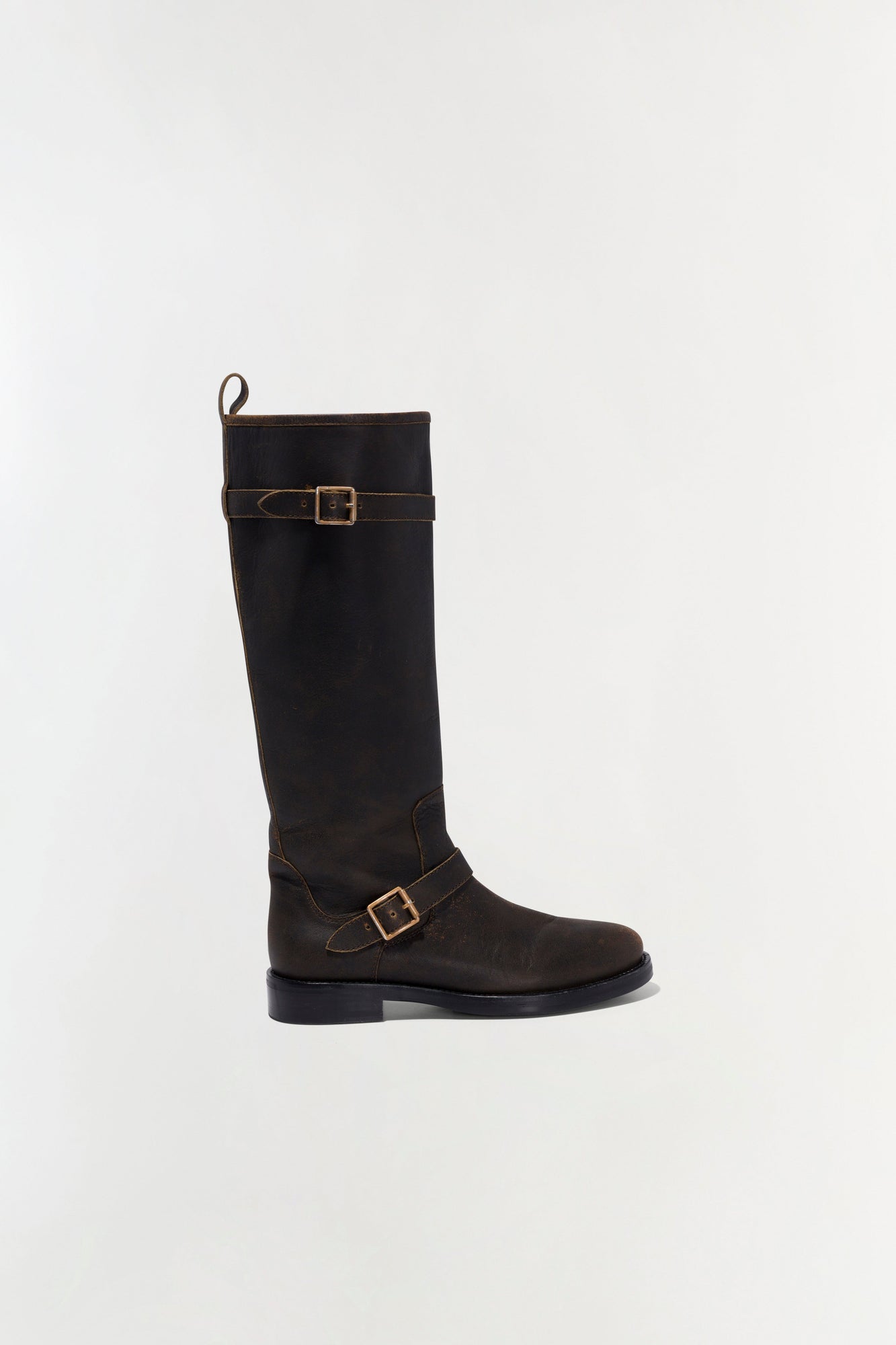 Black leather moto boot with two buckle straps and contrasting topstitching.