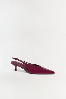 Burgundy slingback kitten heel with pointed toe and adjustable heel strap.