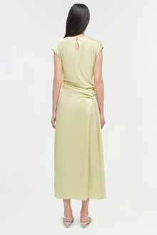 Pale yellow satin midi dress with short capped sleeves, keyhole back detail, and ruched side waist on model.