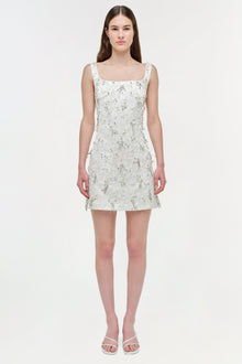 White sleeveless mini dress with silver beaded embellishment throughout, square neckline, and A-line silhouette.
