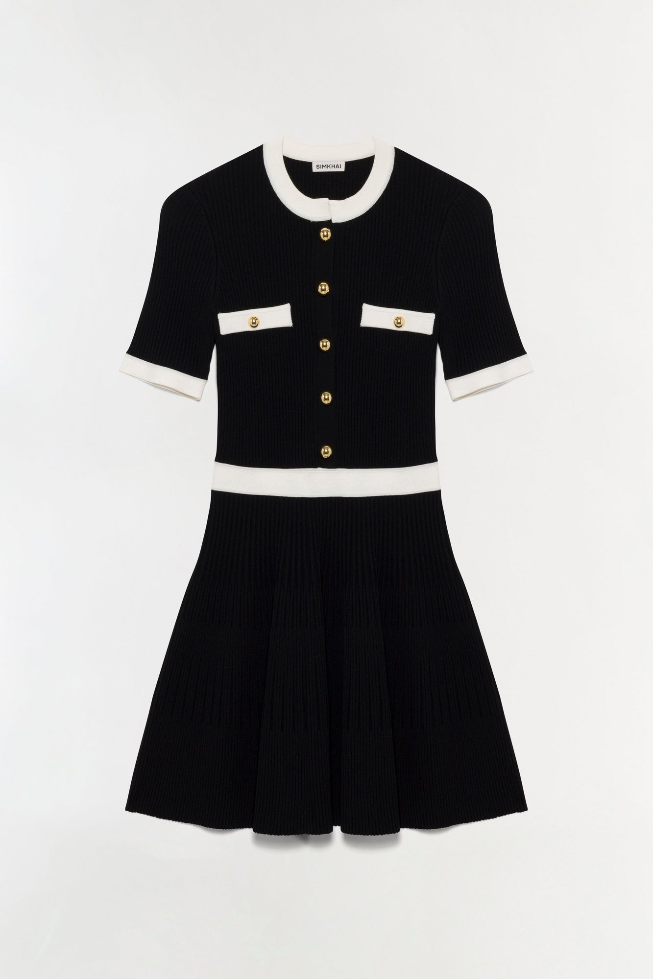 Black ribbed knit mini dress with cream collar, cuffs, and waistband, featuring gold buttons and chest pockets.