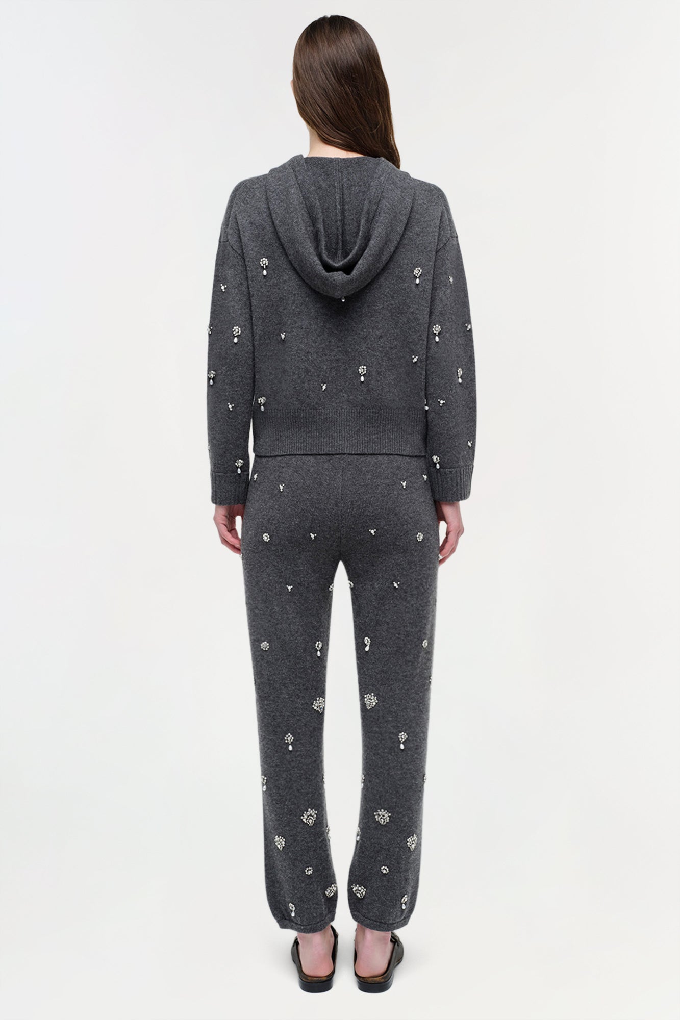 Charcoal cashmere jogger set with scattered crystal embellishments, featuring a hoodie and tapered pants.