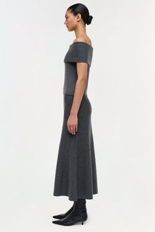 Charcoal gray wool skirt with off-shoulder neckline and flared midi silhouette.