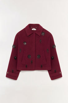 Burgundy wool jacket with black beaded embellishments scattered across front, sleeves, and back, featuring a collar and cropp