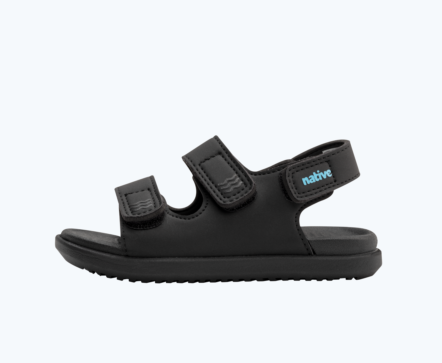 Side view of a Native Shoes Kids Frankie Sugarlite Kids | Jiffy Black/ Jiffy Black Footwear