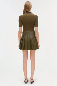 Olive knit mini dress with short sleeves, collared neckline, and pleated skirt, shown on model from back view.