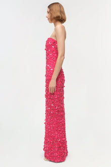 Strapless pink gown with sequin and beaded embellishments throughout, shown on model in side profile.