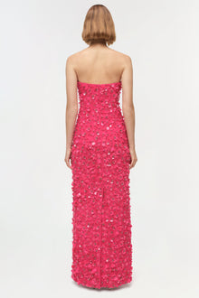 Hot pink strapless gown with sequin and beaded embellishments throughout, shown from back view.