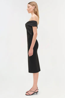 Black off-shoulder midi dress with draped neckline, fitted bodice, and knee-length skirt on model.