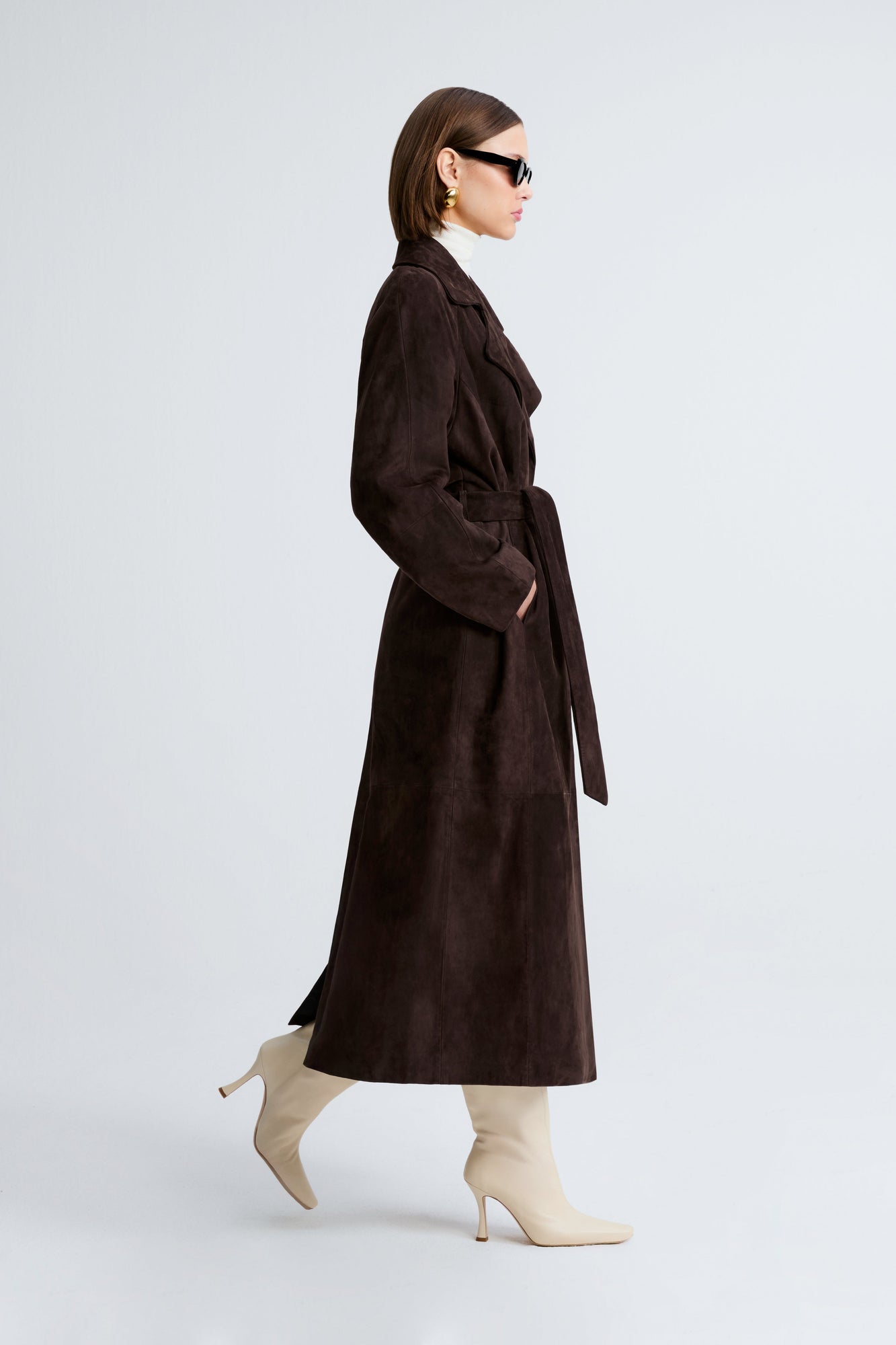 Model is wearing Nour Hammour Althea Belted Suede Coat Mocha - Side