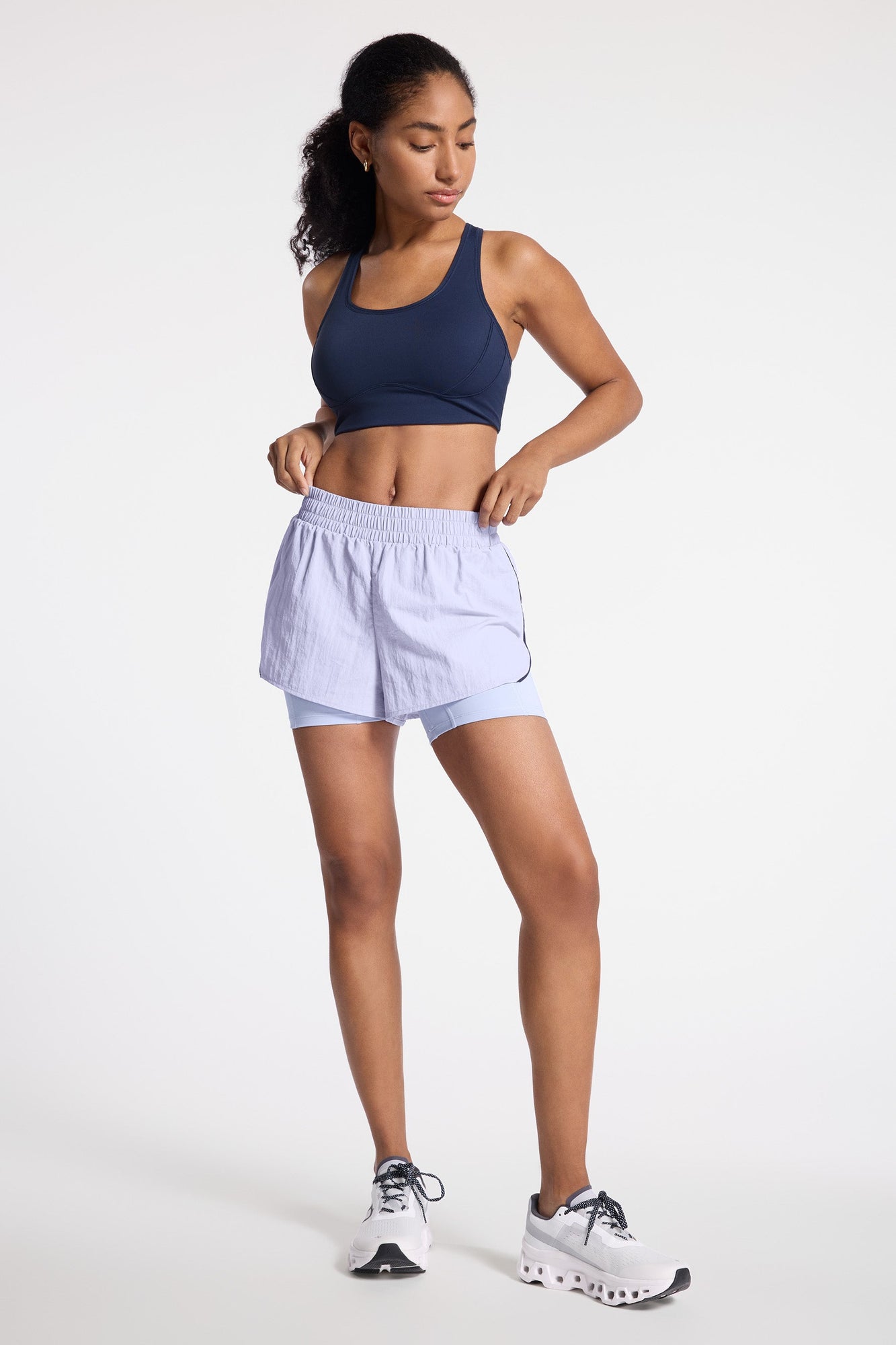 Bandier | Contrast Run Short | Baby Lavender/Navy Blazer