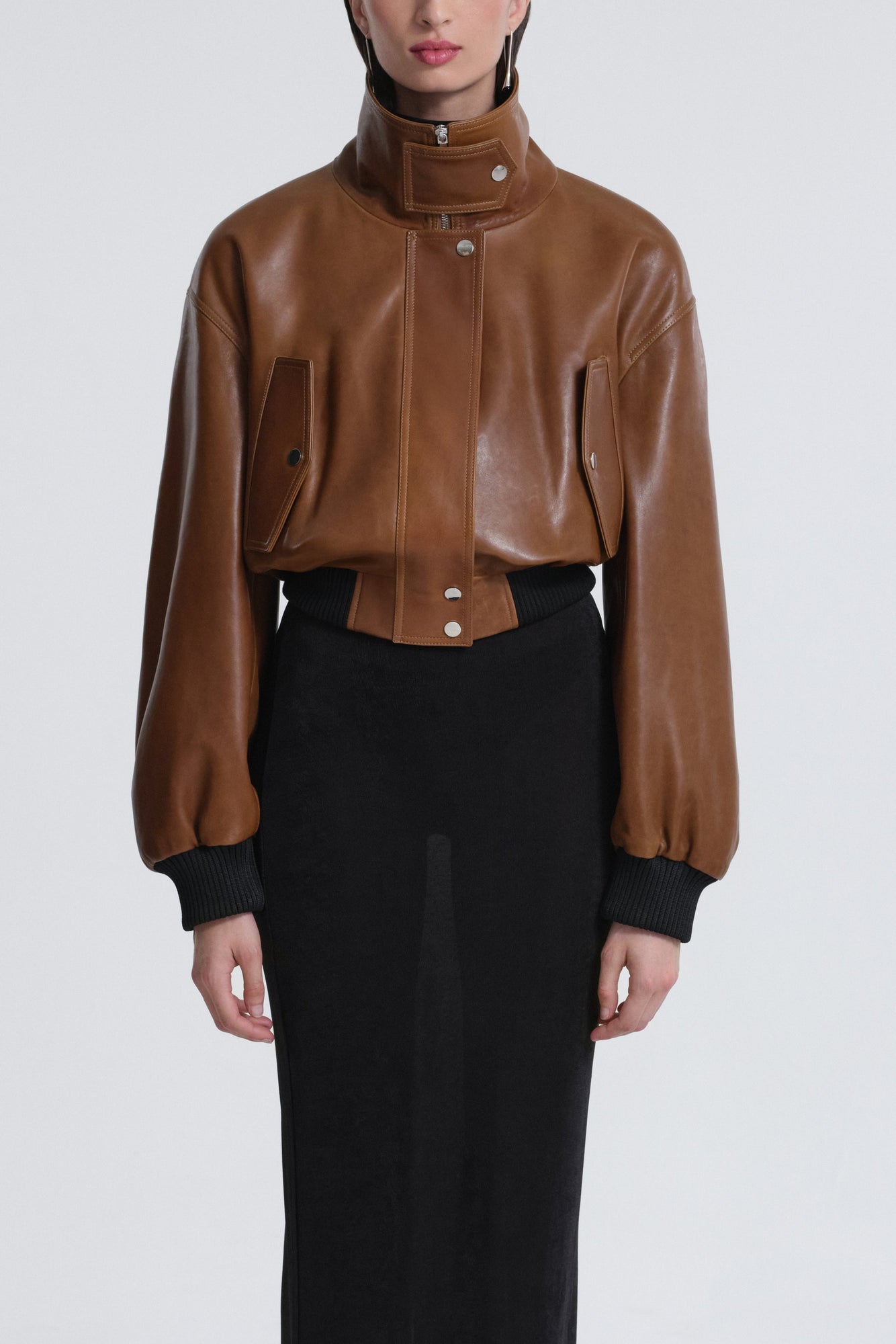 Model is wearing Nour Hammour Briar Cropped Bomber Jacket Praline Patina - Front