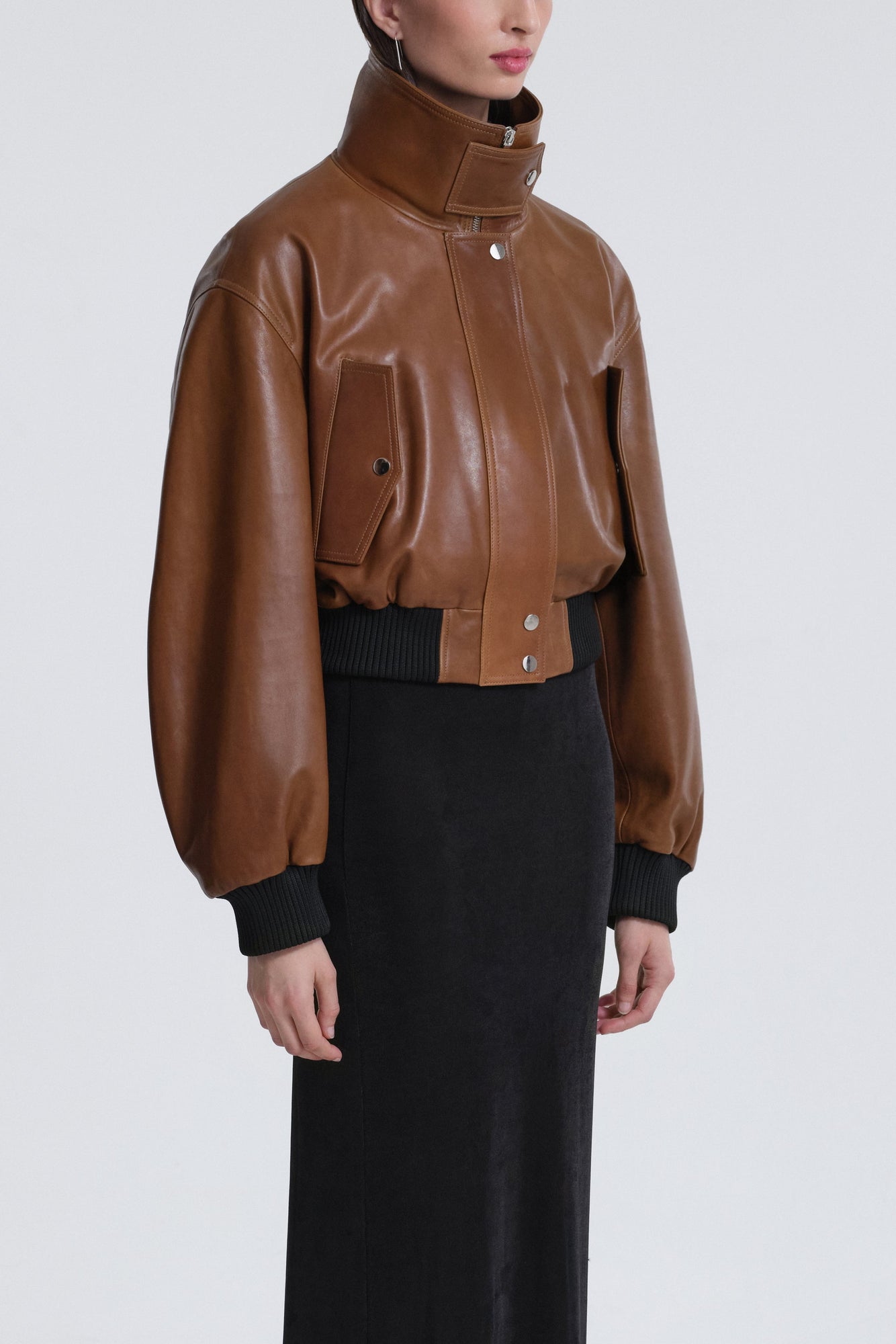 Model is wearing Nour Hammour Briar Cropped Bomber Jacket Praline Patina - Three Quarters