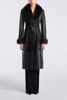 Model is wearing Nour Hammour Baez Luxe Leather Coat Noir Classique - Front