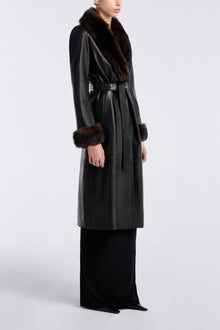 Model is wearing Nour Hammour Baez Luxe Leather Coat Noir Classique - Three Quarters