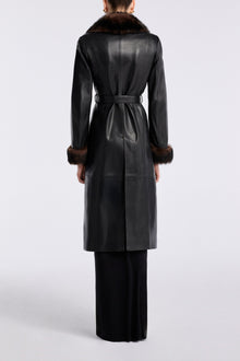 Model is wearing Nour Hammour Baez Luxe Leather Coat Noir Classique - Back
