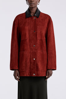 Model is wearing Nour Hammour Barn Modern Suede Jacket Rouge - Front Closed